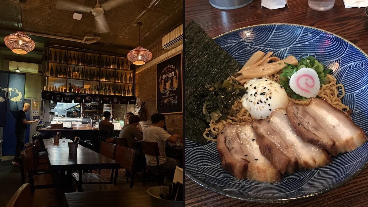 Dim tables beside exposed brick walls.