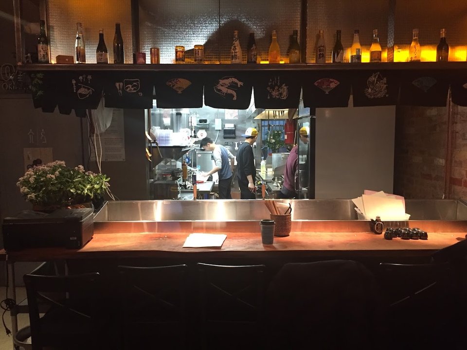 Stylish Japanese restaurant with exposed brick.